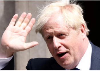 Boris Johnson clings to power as dozens of ministers defect from his government.