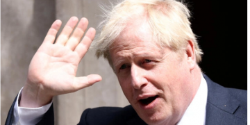 Boris Johnson clings to power as dozens of ministers defect from his government.