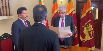 Ranil Wickremesinghe takes his oath as acting President.
