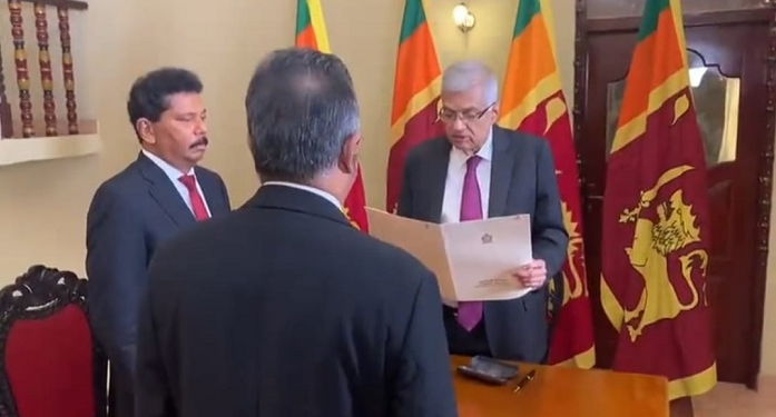Ranil Wickremesinghe takes his oath as acting President.