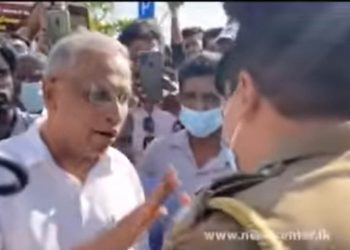 Police surround the Galleface Signature campaign. Sumanthiran was permitted to continue after speaking with police.
