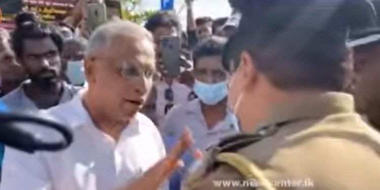 Police surround the Galleface Signature campaign. Sumanthiran was permitted to continue after speaking with police.