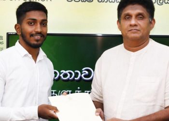 Sajith gives money to wrestling champion Sandaruwan to attend the world championship in Spain while the sports ministry looks away! (PHOTOS)