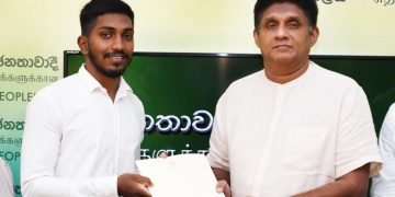 Sajith gives money to wrestling champion Sandaruwan to attend the world championship in Spain while the sports ministry looks away! (PHOTOS)