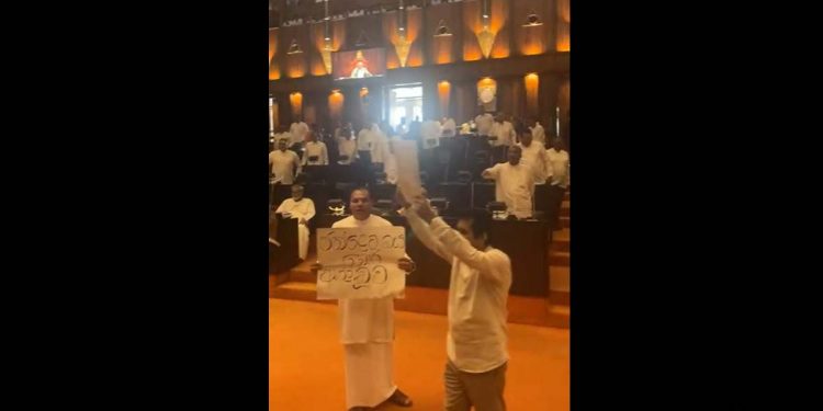 While the President was in the Parliament, the opposition showed up with protest sign asking for election! The President left the House! VIDEO
