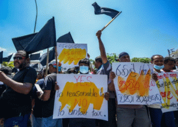 Sri Lanka outlaws strikes as anti-tax protests spread