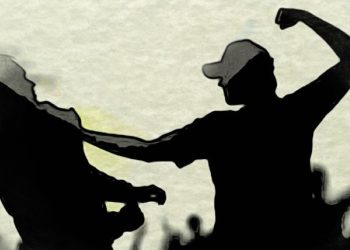 After being assaulted by stateminister’s goons, the owner of an Omani garment factory attempts to leave.