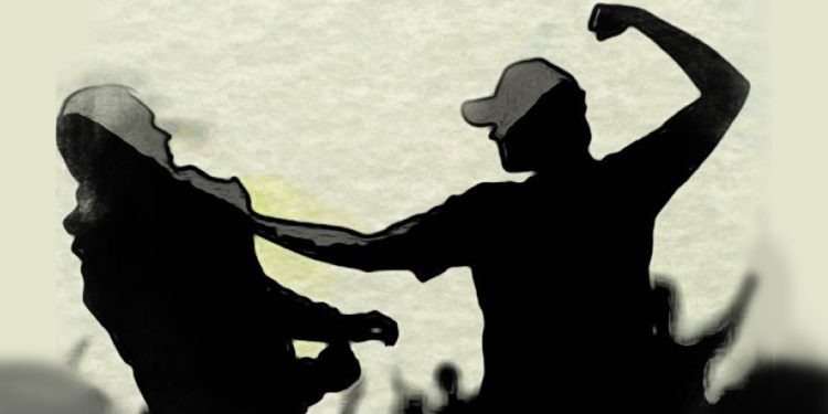 After being assaulted by stateminister’s goons, the owner of an Omani garment factory attempts to leave.