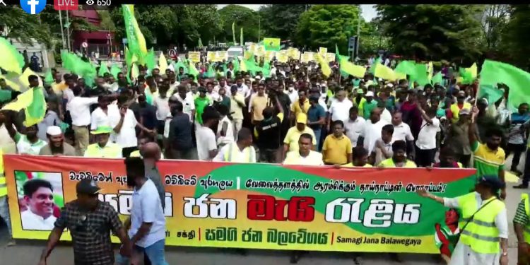 SJB May rally has begun! Massive crowds begin procession towards Fort, led by Sajith! Watch it live right here! VIDEO IN REAL TIME