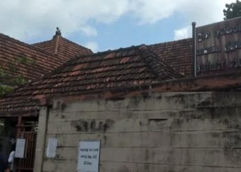 A protester climbs the roof of the Kurunegala court complex I Sri Lanka Latest News
