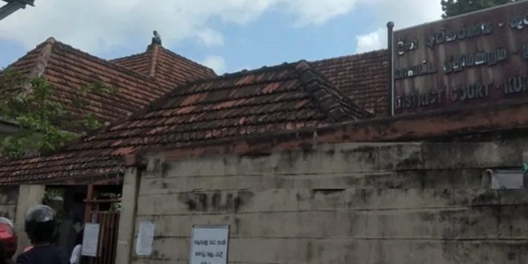 A protester climbs the roof of the Kurunegala court complex I Sri Lanka Latest News