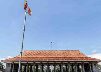 Buddhist Flag Reinstalled After Wimal Weerawansa’s Revelation
